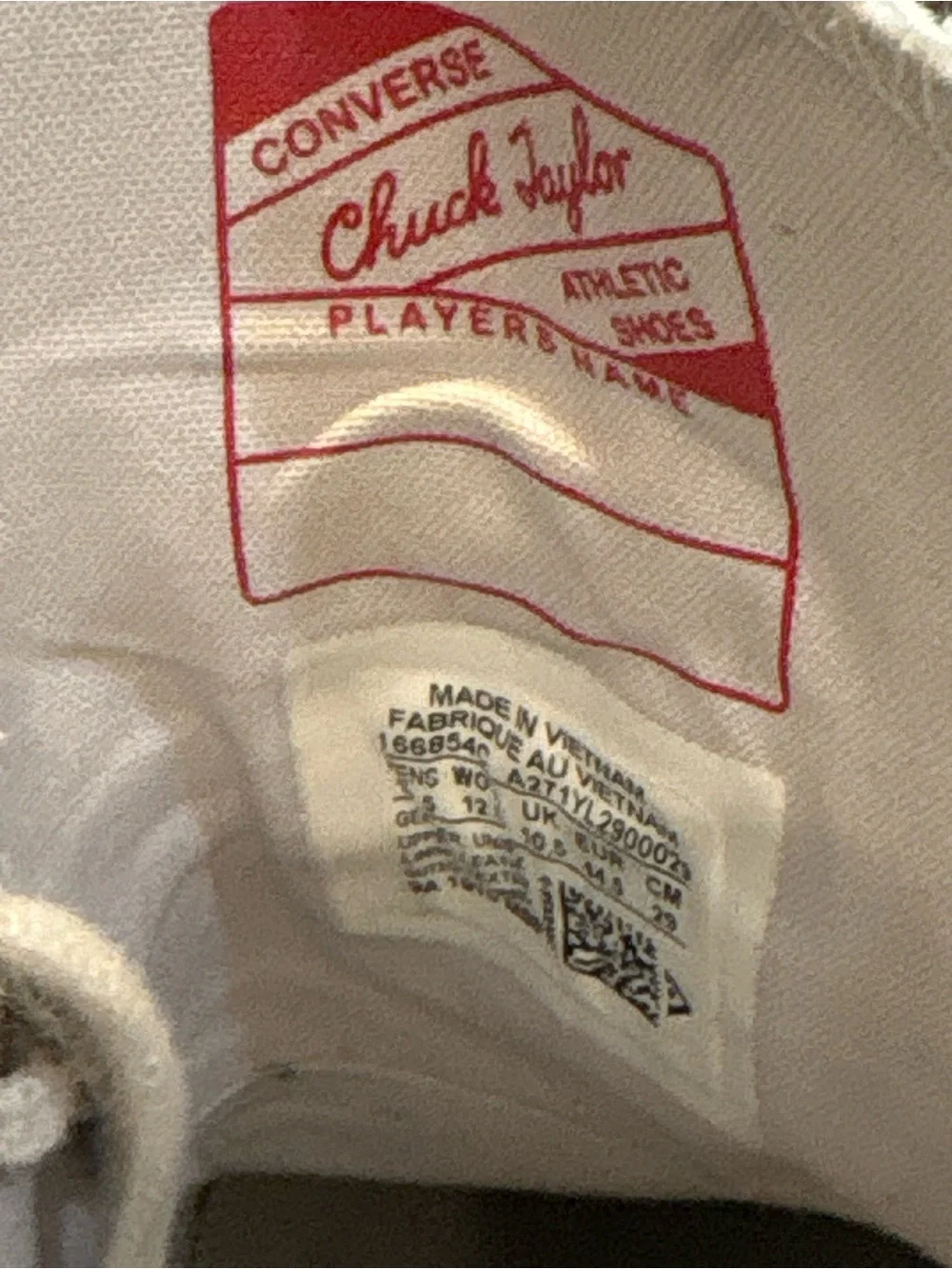 Converse Chuck Taylor’s White High Top Sneakers with Red and Blue Accents